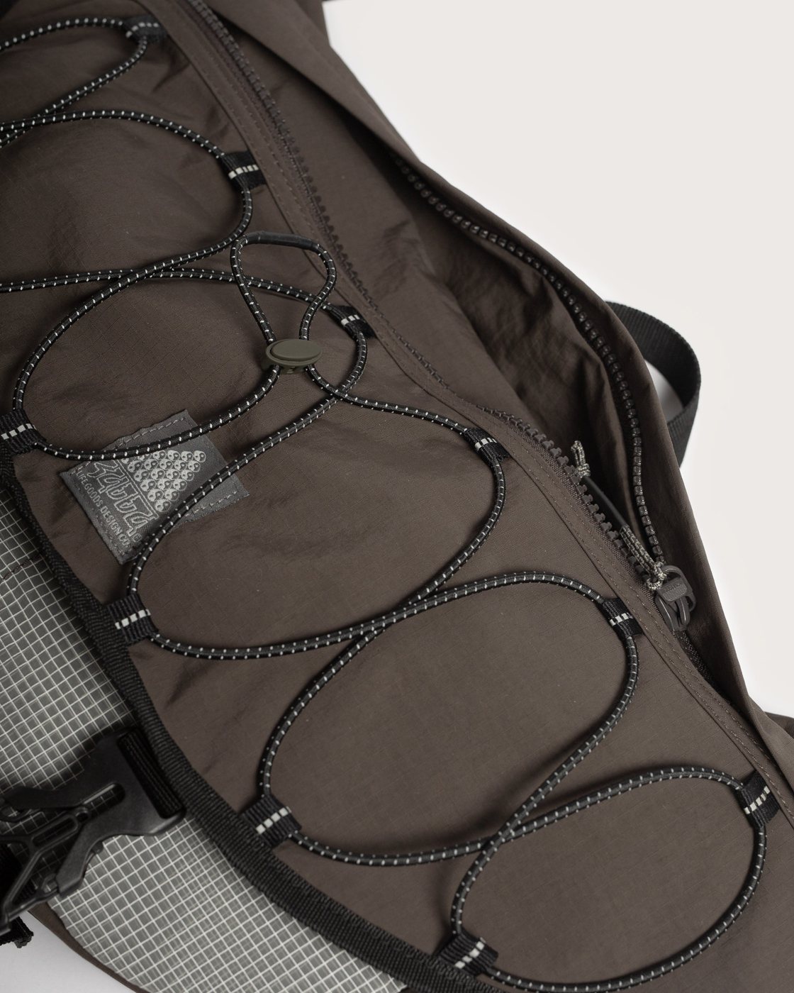 Bungee cord detail on the crossbody bag