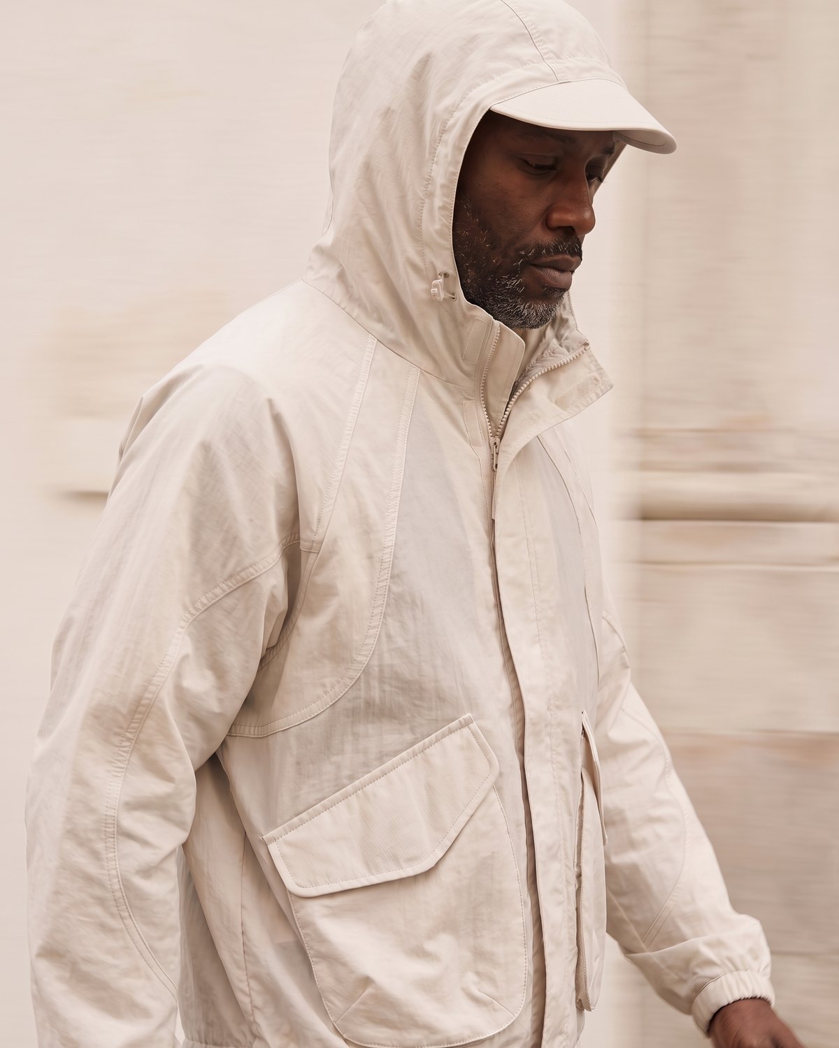 Menswear AW27: hooded cocoon jacket, walking