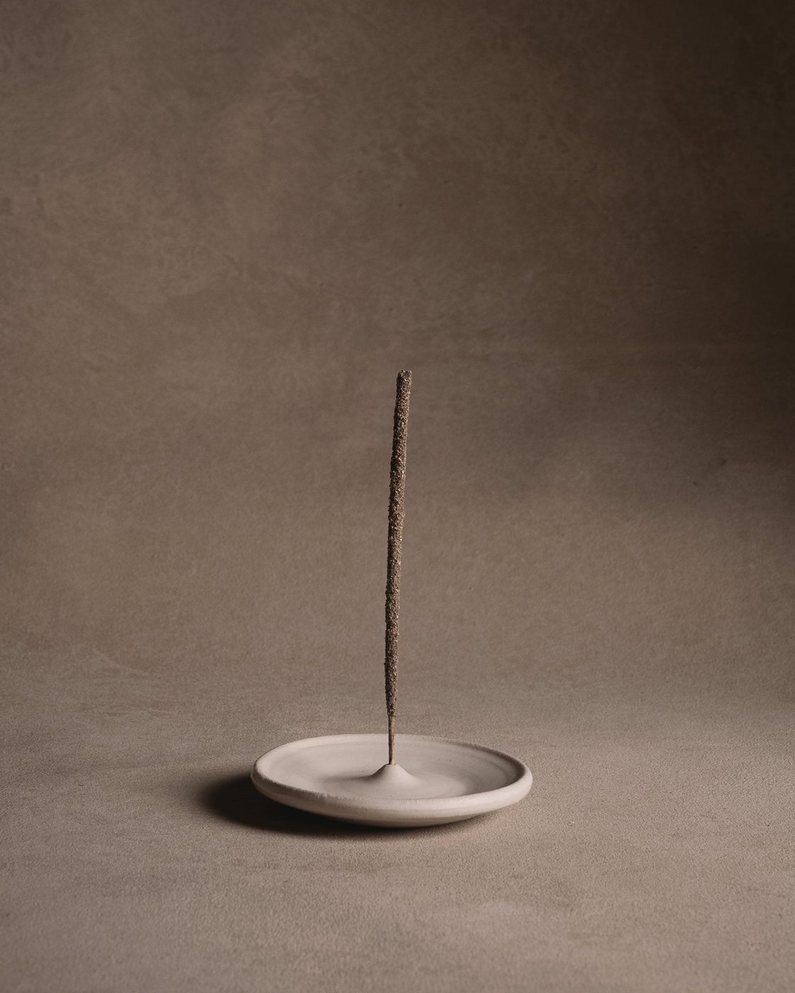 Wheel-thrown incense holder in matte white glaze
