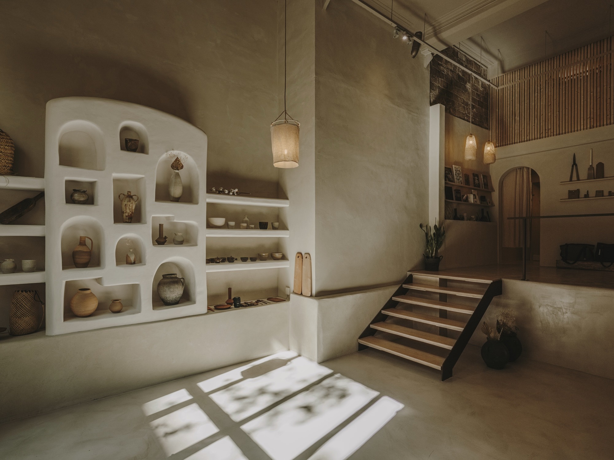 Satta Studio: plaster shelving with ceramics