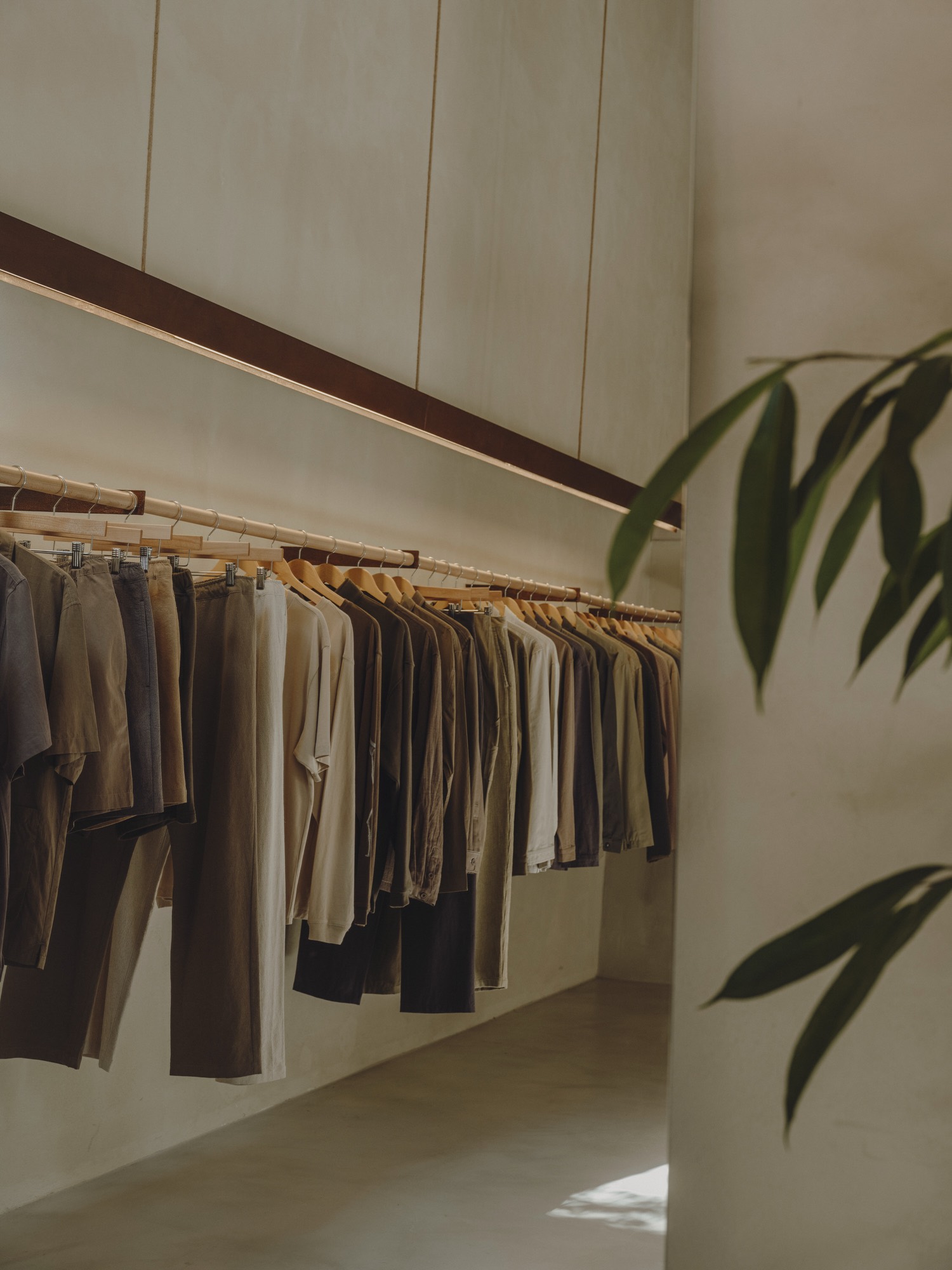 Clothing rail under a timber beam