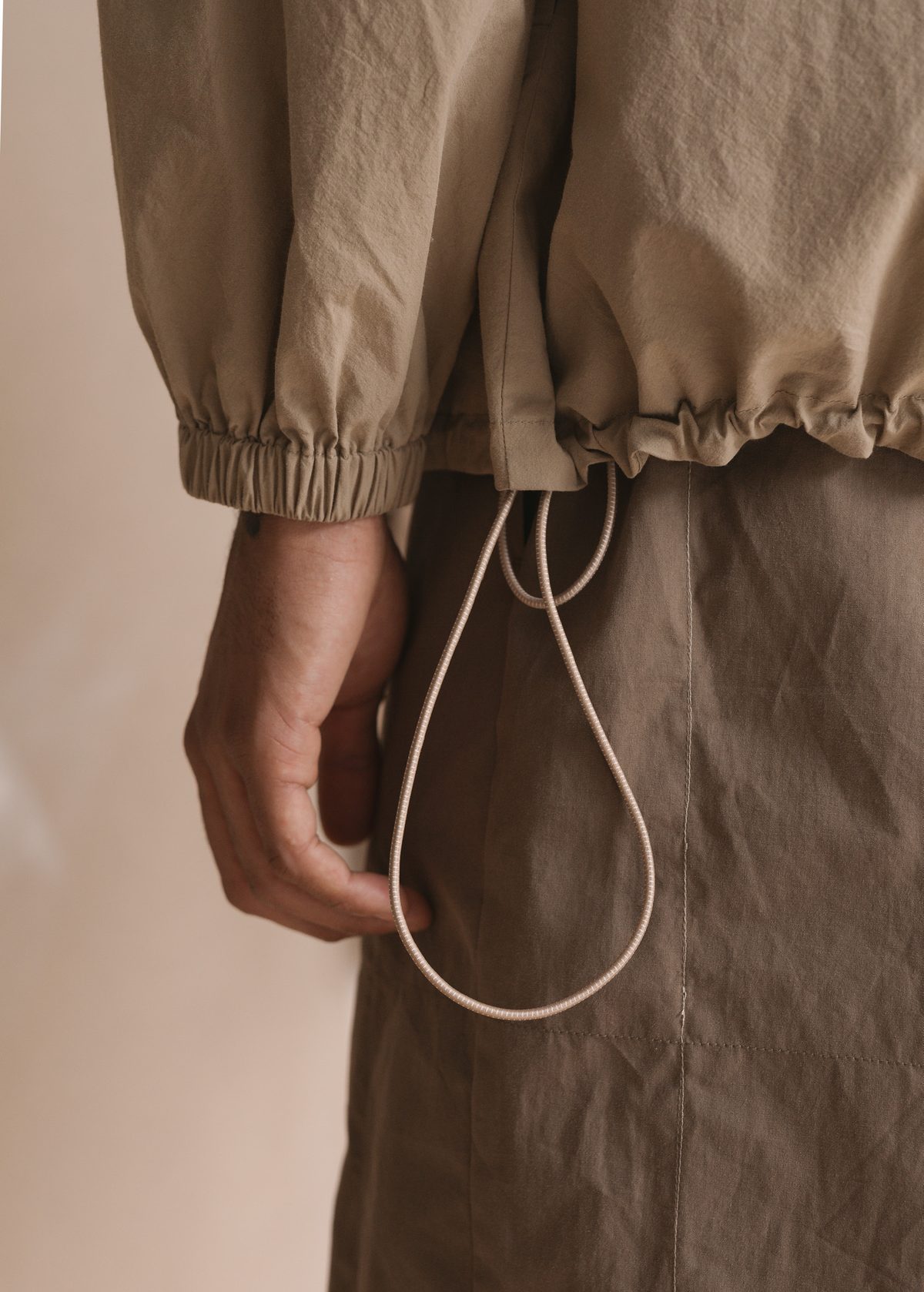 Satta SS25: elasticated cuff and drawcord hem