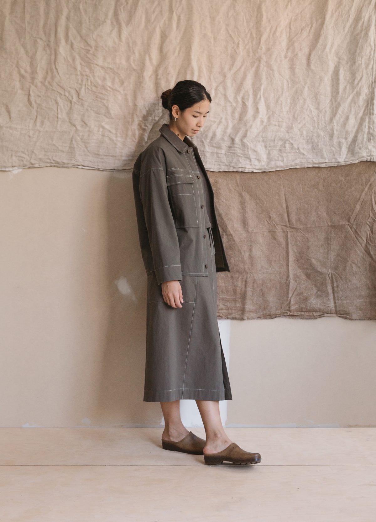 Dark workwear jacket over a long skirt