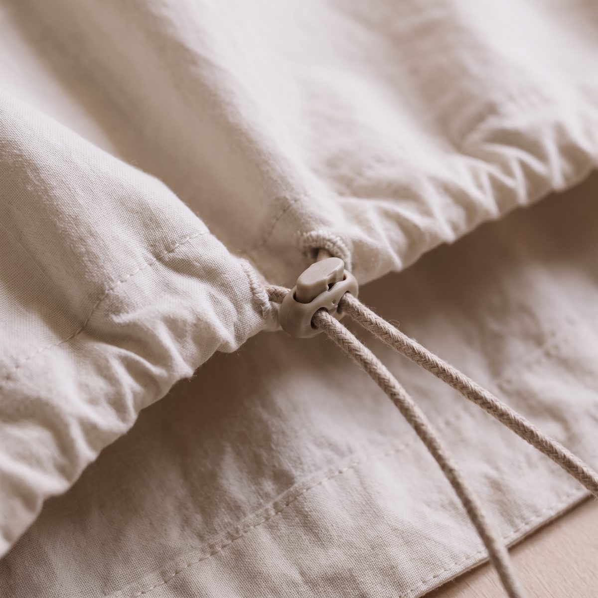Close-up of drawcord and toggle hem